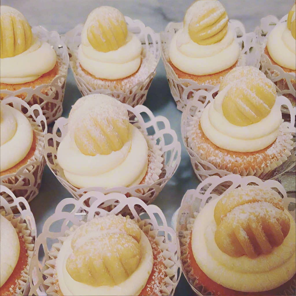 Cupcakes with custard cream on a cooling rack, shared on Instagram.