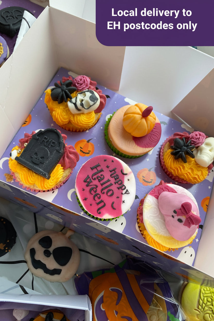 Halloween-themed cupcakes in a box with decorative elements.