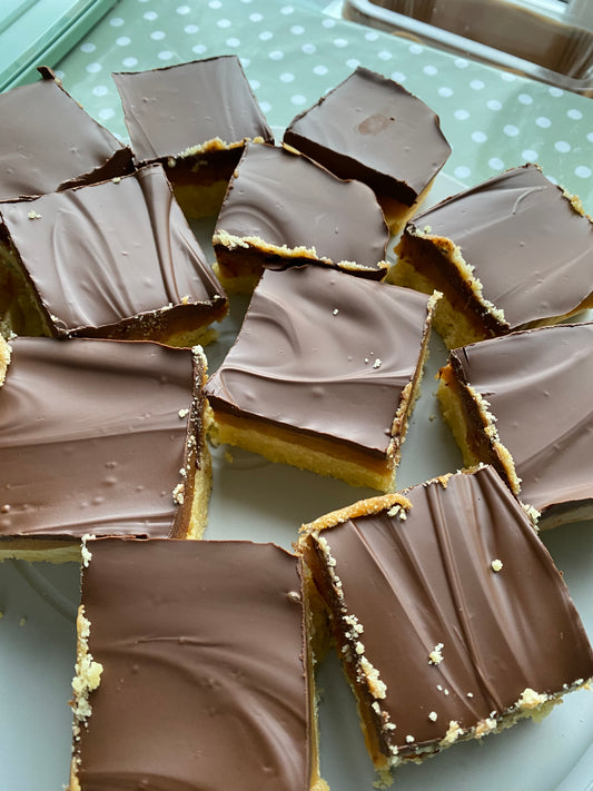 A full traybake of caramel shortcake sliced into squares and on display